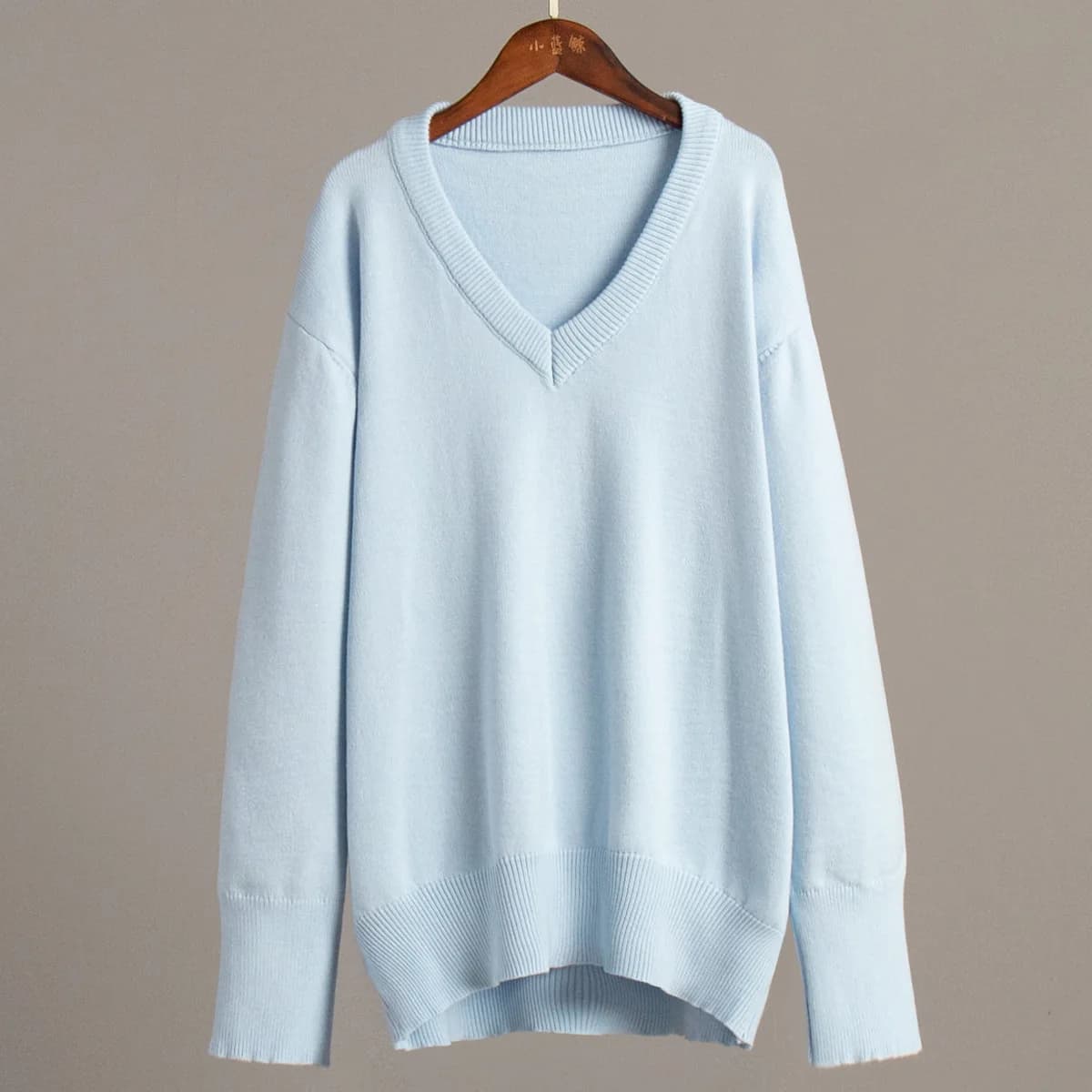 Pull à col en v femmes 2025 automne et hiver couleur unie européenne et américaine pull polyvalent p