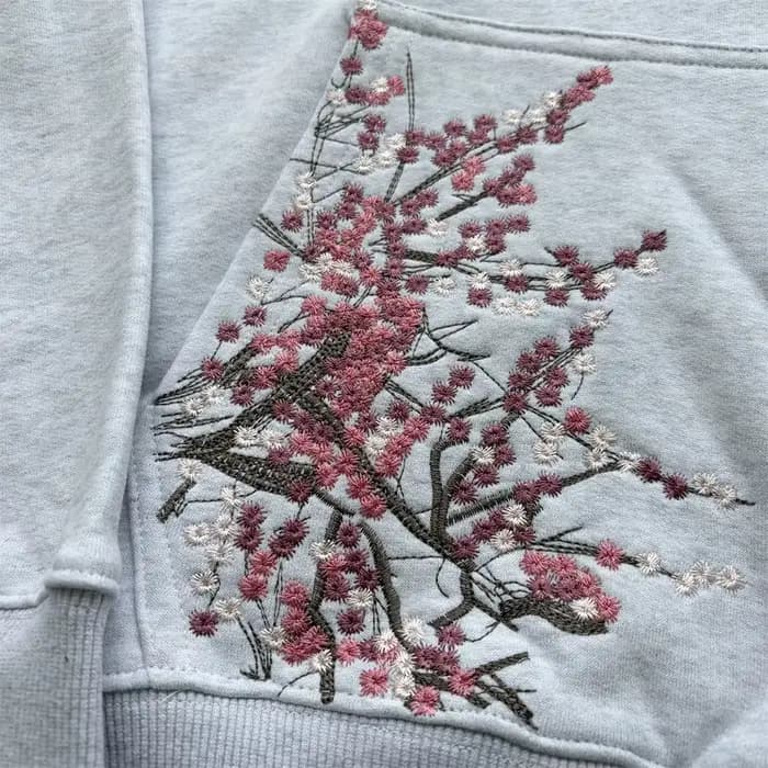 Sweat à capuche brodé motif fleur de prunier pour homme et femme