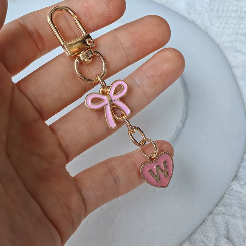 Lettres créatives métal rose arc porte-clés mode A-Z 26 lettres porte-clés breloques téléphone porta