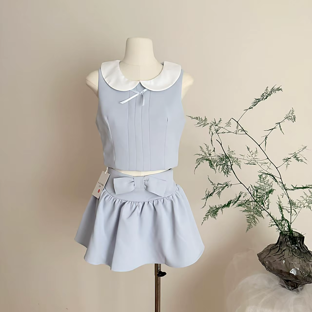 Ensemble jupe deux pièces d'été pour femme, style mignon, avec haut court sans manches à col Peter P